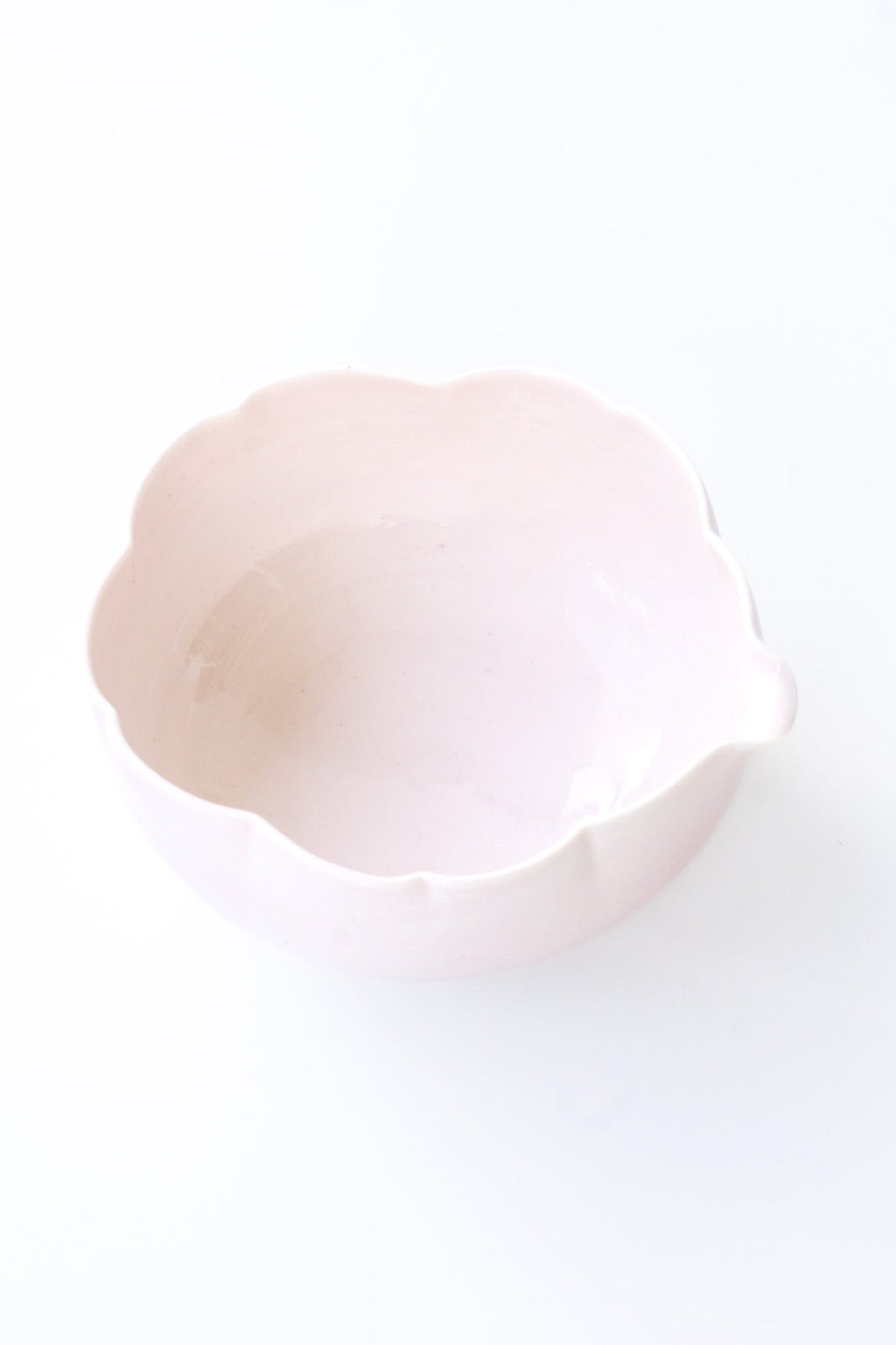 Close-up of a pink flower matcha bowl on a white background