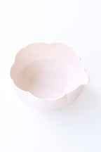 Close-up of a pink flower matcha bowl on a white background
